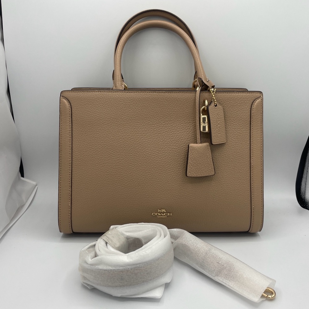 Coach Zoë Carryall Crossbody beige leather purse handbag with tag still on.